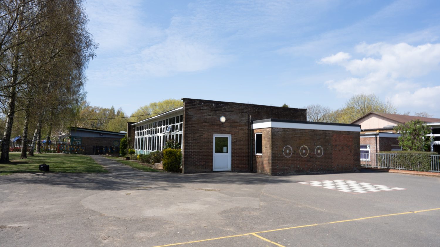 A building and play area at Molehill Primary Academy.